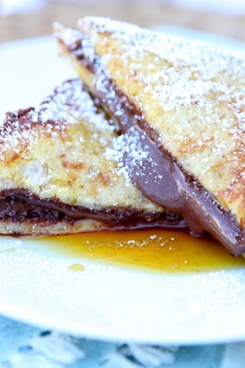 Nutella Stuffed French Toast Recipe on twopeasandtheirpod.com. Nutella lovers will go crazy for this decadent French toast recipe!