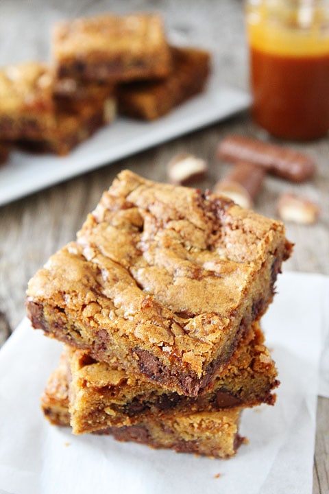 Twix Caramel Cookie Bars Recipe on twopeasandtheirpod.com. The BEST cookie bars! You NEED to make these!