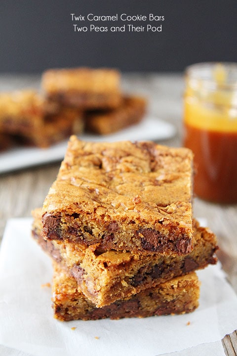 Twix Caramel Cookie Bars Recipe on twopeasandtheirpod.com. Cookie bars with Twix candy bars, caramel, and a sprinkle of sea salt! YUM!