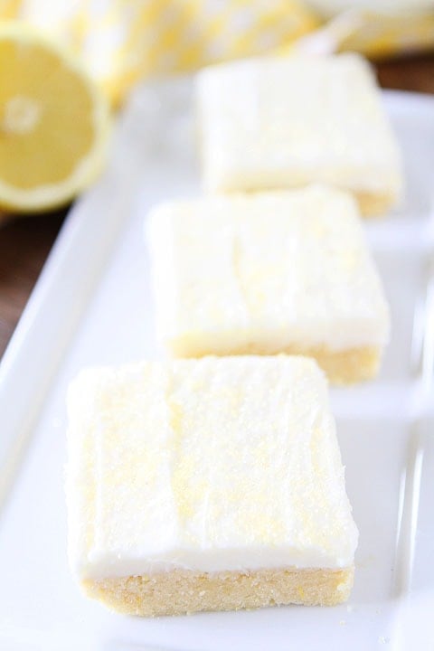Lemon Sugar Cookie Bars Recipe on twopeasandtheirpod.com. Soft sugar cookie bars with lemon cream cheese frosting! Everyone will want this recipe! #lemon #dessert
