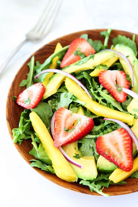 Mango, Strawberry, and Avocado Arugula Salad Recipe on twopeasandtheirpod.com. Love this gorgeous and simple salad! #salad #glutenfree #vegan