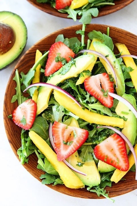 Mango, Strawberry, and Avocado Arugula Salad Recipe on twopeasandtheirpod.com. Love this beautiful and healthy salad! #salad #glutenfree #vegan