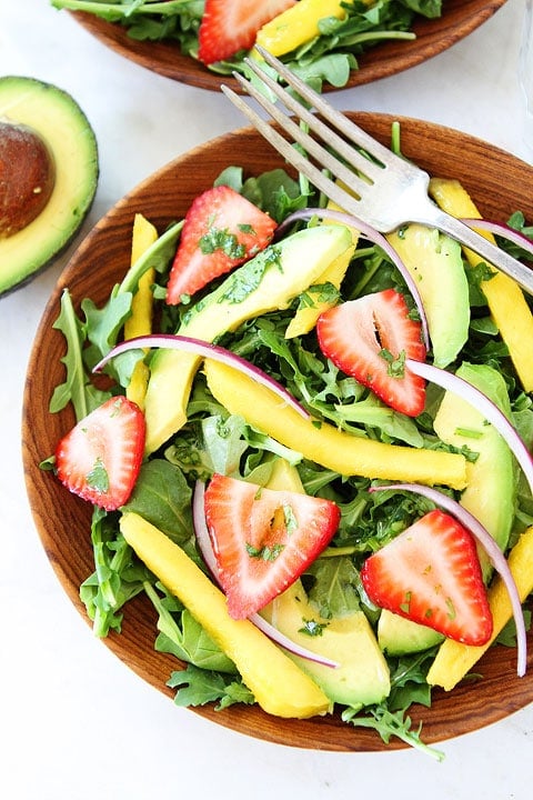 Mango, Strawberry, and Avocado Arugula Salad Recipe on twopeasandtheirpod.com. #salad #glutenfree #vegan