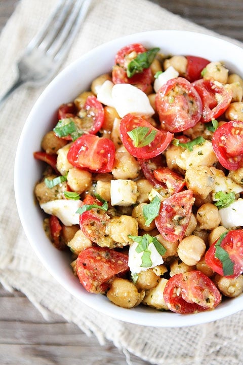 Chickpea, Pesto, Tomato, and Mozzarella Salad Recipe on twopeasandtheirpod.com Only 4 ingredients needed to make this healthy salad!