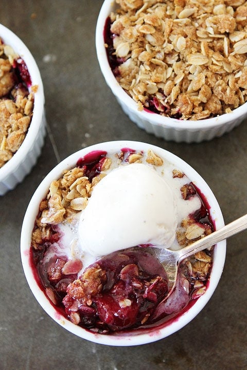 Rhubarb Triple Berry Crisp topped with vanilla ice cream