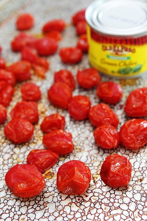 Green Chile and Roasted Tomato Guacamole Recipe on twopeasandtheirpod.com #recipe