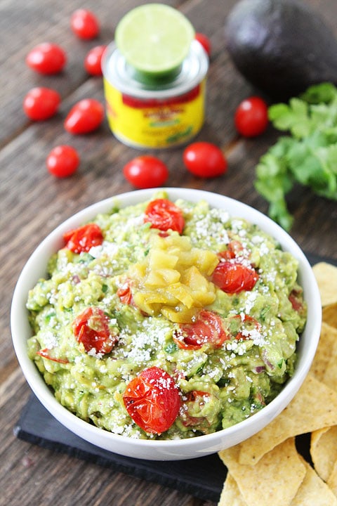 Green Chile and Roasted Tomato Guacamole Recipe on twopeasandtheirpod.com LOVE this guacamole recipe! 