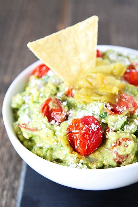 Green Chile and Roasted Tomato Guacamole Recipe on twopeasandtheirpod.com This guacamole recipe is a favorite at our house! #appetizer #glutenfree