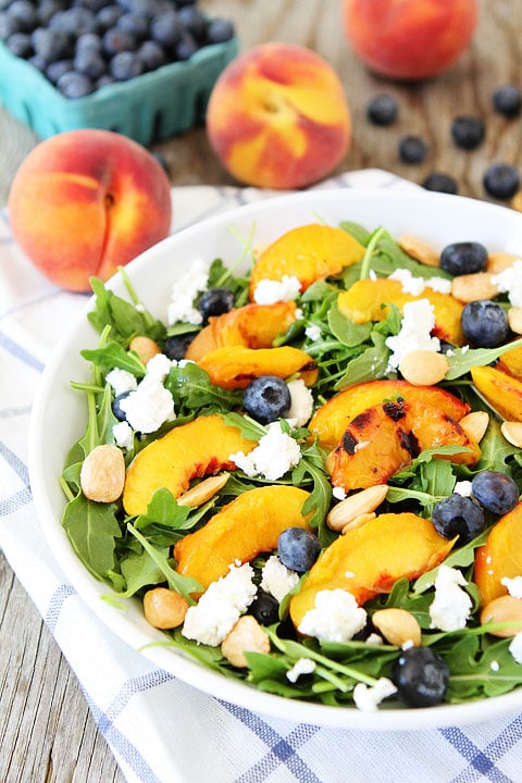 Grilled Peach, Blueberry, and Goat Cheese Arugula Salad Recipe on twopeasandtheirpod.com Love this simple and beautiful summer salad! #salad