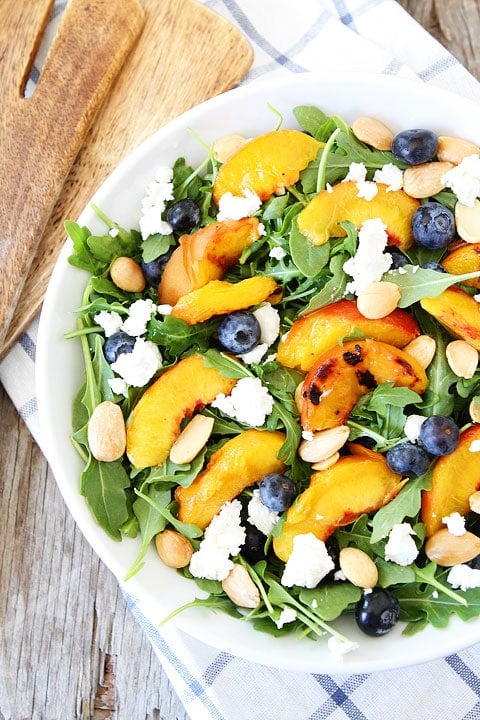 Grilled Peach, Blueberry, and Goat Cheese Arugula Salad Recipe on twopeasandtheirpod.com The perfect summer salad! #salad