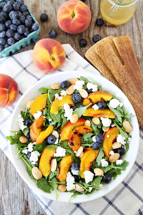 Grilled Peach, Blueberry, and Goat Cheese Arugula Salad Recipe on twopeasandtheirpod.com #salad #summer #vegetarian