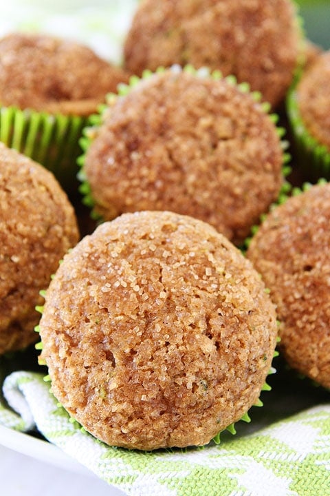 Apple Zucchini Muffins Recipe on twopeasandtheirpod.com A great recipe for using up your summer zucchini! Bunch of Apple Zucchini Muffins