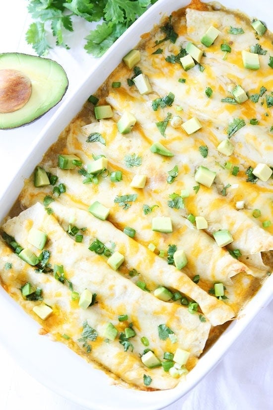 Creamy Spinach and Cheese Green Chile Enchiladas Recipe on twopeasandtheirpod.com We love these easy enchiladas and they freeze well too! #vegetarian #dinner