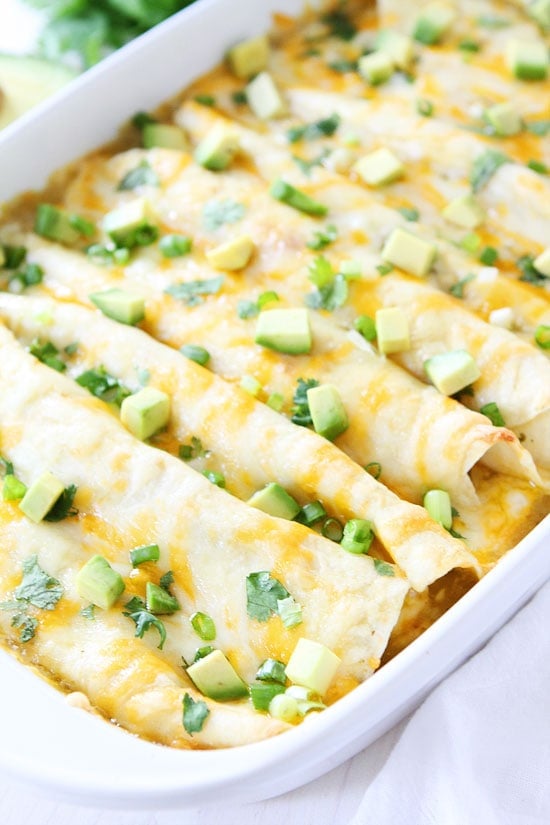 Creamy Spinach and Cheese Green Chile Enchiladas Recipe on twopeasandtheirpod.com Great for dinner recipe and they freeze well too! 