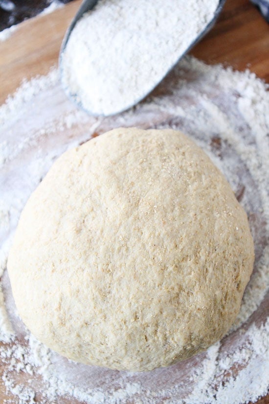 Easy Whole Wheat Pizza Dough Recipe on twopeasandtheirpod.com This pizza dough recipe makes the BEST pizza! 