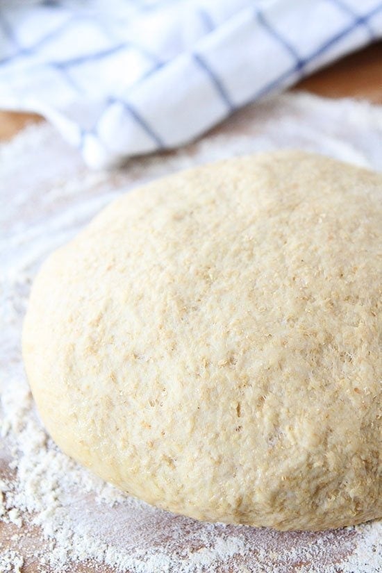 Easy Whole Wheat Pizza Dough Recipe on twopeasandtheirpod.com This pizza dough recipe is SO easy and makes a perfect pizza every time!