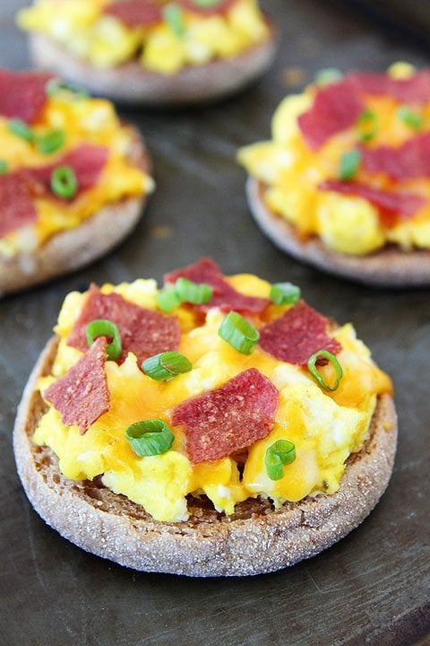 English Muffin Breakfast Pizzas on twopeasandtheirpod.com These easy breakfast pizzas are great for breakfast or anytime of the day!