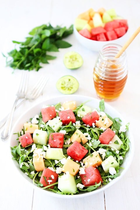 Melon Arugula Salad with Honey Lime Dressing Recipe on twopeasandtheirpod.com Love this refreshing summer salad! #salad