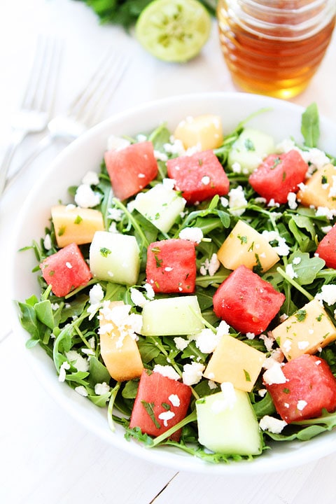 Melon Arugula Salad with Honey Lime Dressing Recipe on twopeasandtheirpod.com The perfect summer salad! #salad #glutenfree