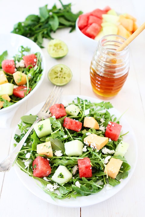 Melon Arugula Salad with Honey Lime Dressing Recipe on twopeasandtheirpod.com Love this healthy summer salad! #salad