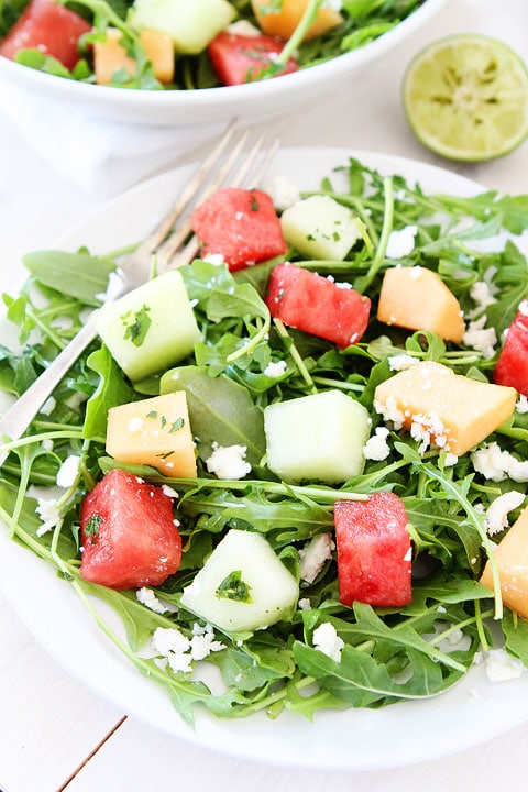 Melon Arugula Salad with Honey Lime Dressing Recipe on twopeasandtheirpod.com #salad #recipe #glutenfree