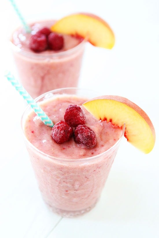 Peach Raspberry Smoothie topped with fresh fruit 