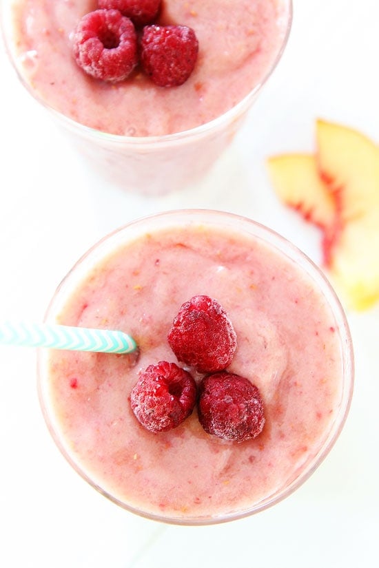 Raspberry Smoothie with fresh raspberries on top