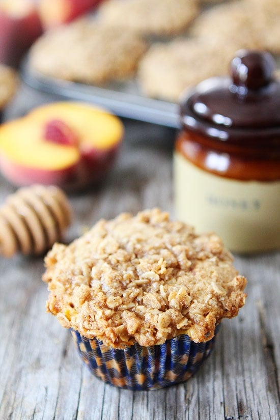 Honey Peach Muffins with Oat Streusel Topping Recipe on twopeasandtheirpod.com These muffins are a MUST make! #muffins #recipe