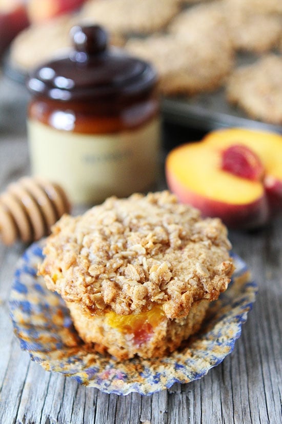 Honey Peach Muffins with Oat Streusel Topping Recipe on twopeasandtheirpod.com These muffins are a MUST make! #breakfast