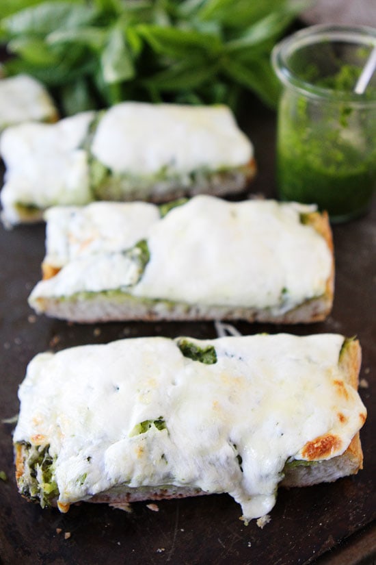 Pesto Cheese Bread Recipe on twopeasandtheirpod.com You only need 4 ingredients to make this cheesy bread! #bread