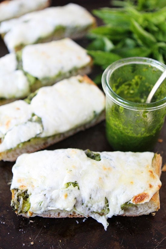 Pesto Cheese Bread Recipe on twopeasandtheirpod.com You only need 4 ingredients to make this cheesy bread! #recipe