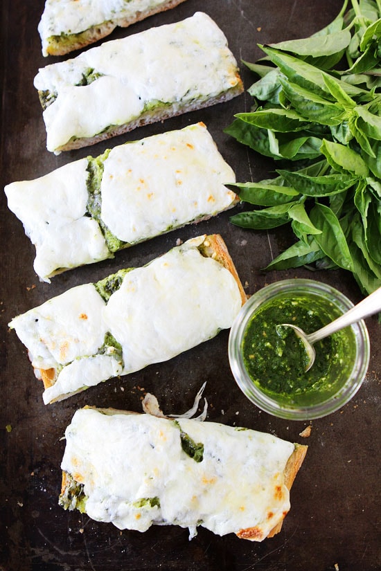 Pesto Cheese Bread Recipe on twopeasandtheirpod.com This bread is great as an appetizer, side dish, or even dinner!