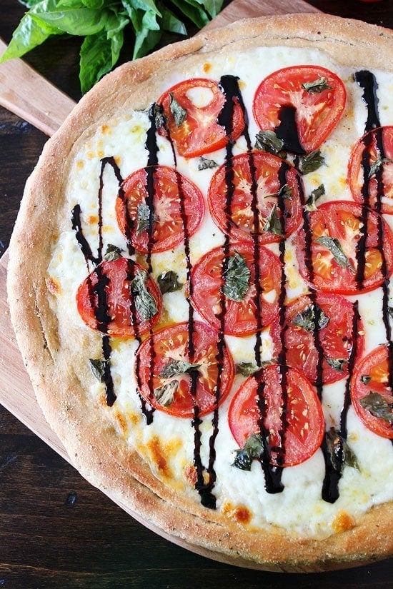 Caprese Pizza Recipe on twopeasandtheirpod.com This classic pizza is always a winner! #pizza
