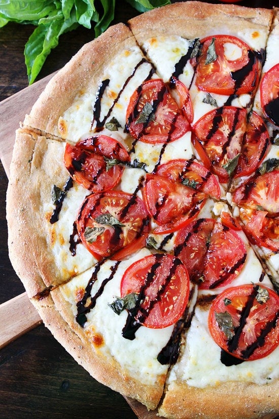 Caprese Pizza Recipe on twopeasandtheirpod.com This classic pizza recipe is always a favorite! #pizza