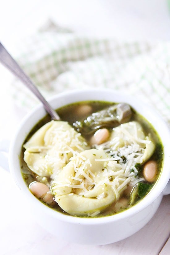 Spinach Artichoke Pesto Tortellini Soup Recipe on twopeasandtheirpod.com