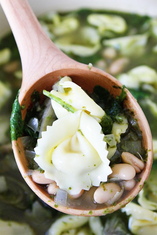 Spinach Artichoke Pesto Tortellini Soup Recipe on twopeasandtheirpod.com