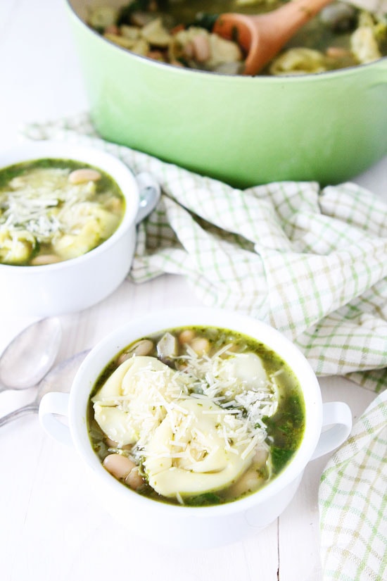 Spinach Artichoke Pesto Tortellini Soup Recipe on twopeasandtheirpod.com