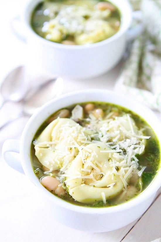 Spinach Artichoke Pesto Tortellini Soup Recipe on twopeasandtheirpod.com