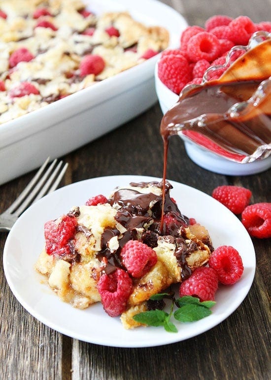 Raspberry Chocolate Bread Pudding Recipe on twopeasandtheirpod.com The raspberries and chocolate make this bread pudding extra special! 