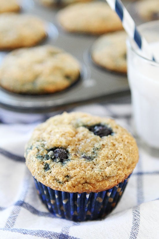vegan blueberry muffins served with a glass of milk