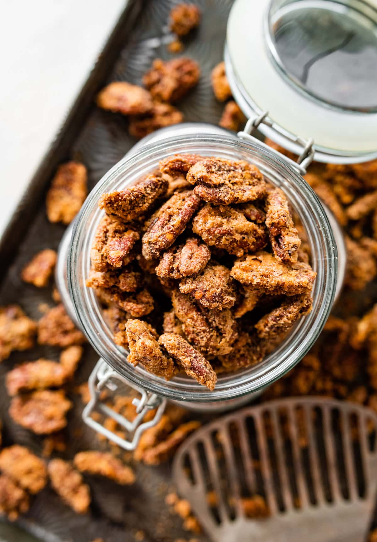 candied pecans in glass jar.