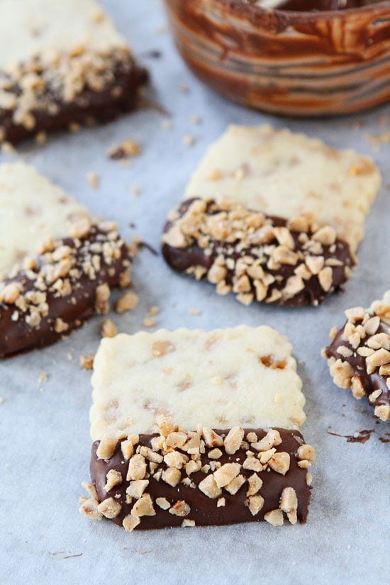 Chocolate Dipped Toffee Shortbread Recipe on twopeasandtheirpod.com 