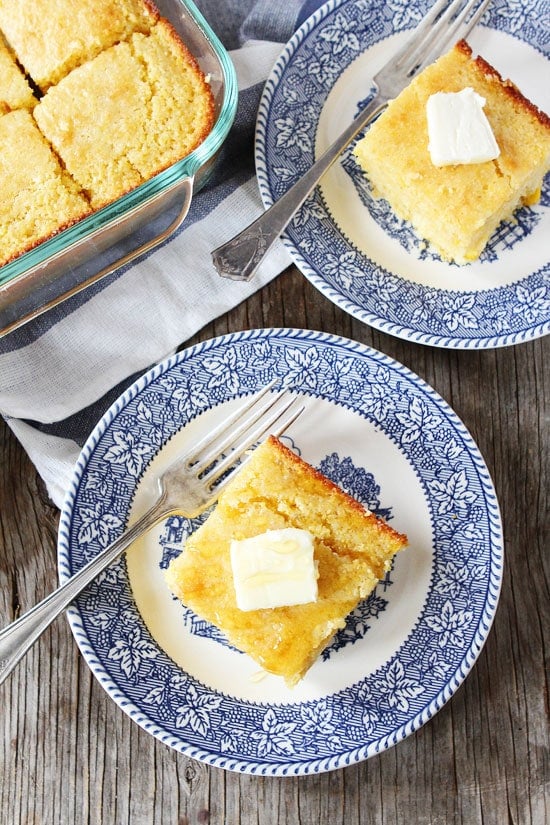 Easy homemade cornbread slices served on plates with butter and honey