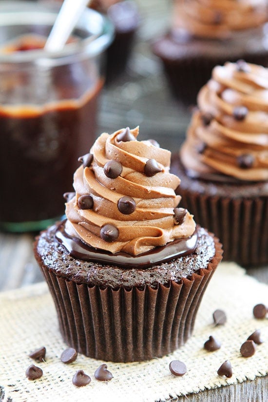 Ultimate Chocolate Cupcake Recipe on twopeasandtheirpod.com The BEST chocolate cupcake you will ever eat. Chocolate cupcake with silky chocolate ganache and the most amazing chocolate buttercream. These cupcakes are divine! Chocolate Cupcake Recipe with Chocolate Ganache and Buttercream Frosting