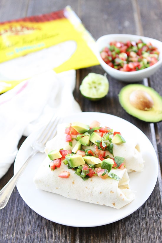 Breakfast Burrito with Chorizo and Bacon topped with avocado