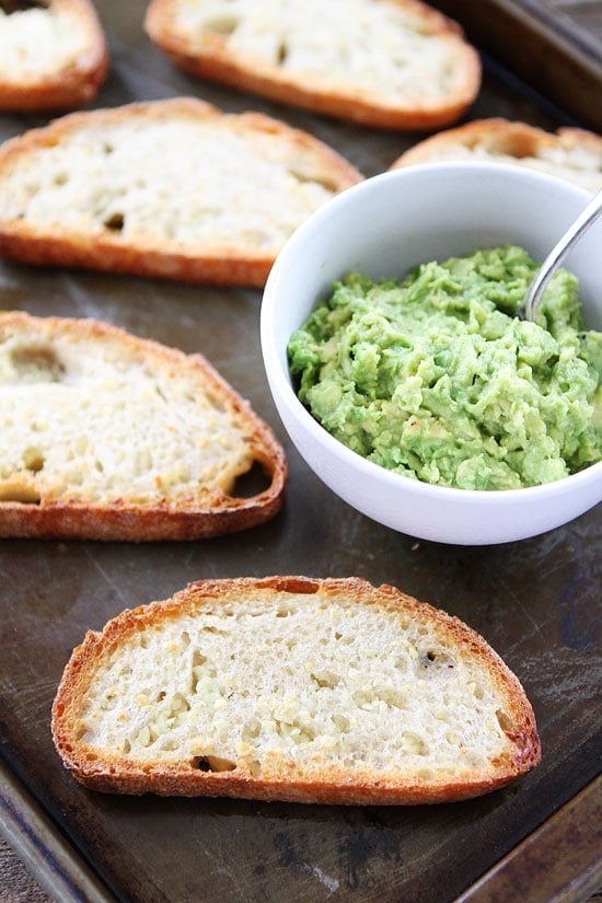 Spooning avocado mash for Garlic Avocado Toast Recipe