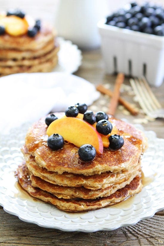 Cinnamon Oatmeal Pancakes with fruit on top