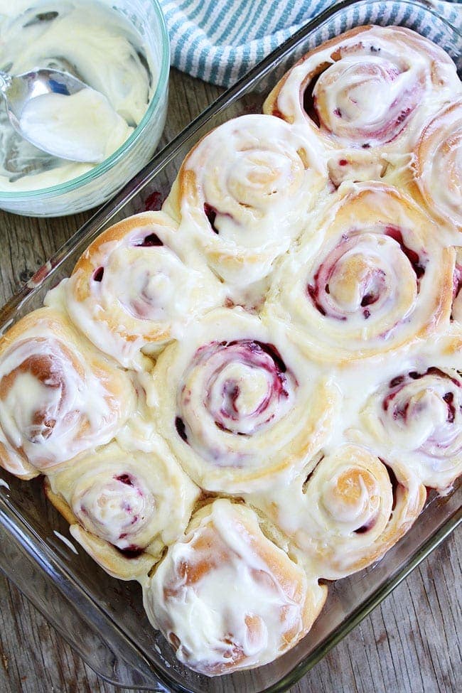 Soft and sweet raspberry yeast rolls topped with cream cheese frosting. Perfect for breakfast or brunch!