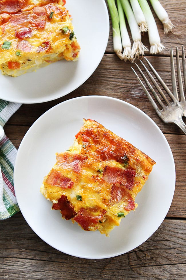 Bacon, Potato, and Egg Casserole Recipe on twopeasandtheirpod.com This easy breakfast casserole is packed with bacon, potatoes, and cheese! It is always a hit! Egg Bake recipe with bacon, egg, and potato ready to serve