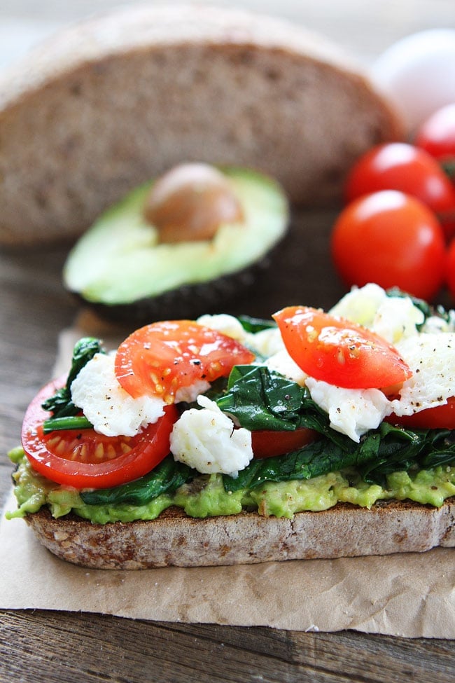 Avocado Toast with Eggs, Spinach, and Tomatoes Recipe